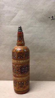 hand painted decorative bottle with pointy top brown