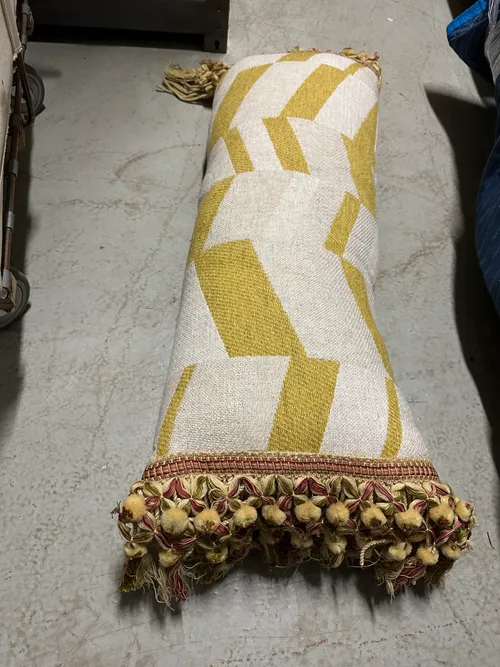 gold and white chevron pattern lumbar pillow with fringe 