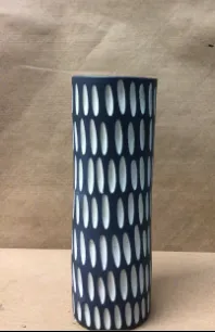 blue cylinder vase with cutaway design