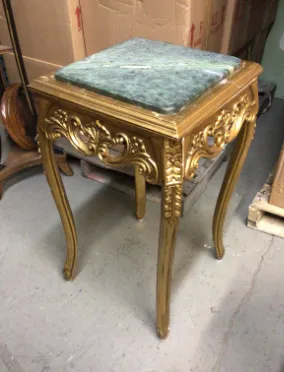 small ornate gold side table with green marble top
