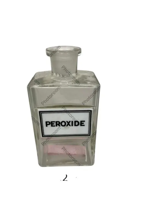 vintage glass peroxide bottle with label