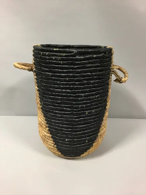 black and tan woven basket with handle 