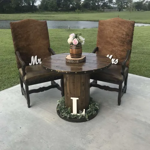 Spool Table with decorative nail heads!   We have 2 for matching Cake Tables
