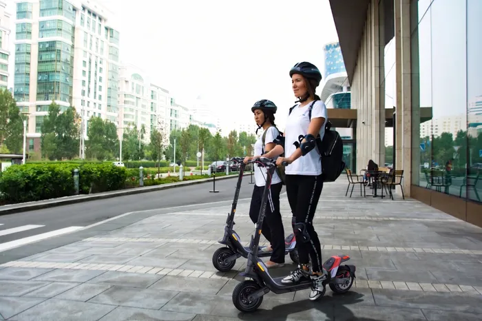 Two people riding Segway P100 Scooters offered through MyPEV Rentals in Jacksonville, FL