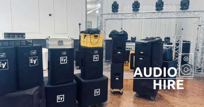 Stacks of speakers at an Audio Hire event.