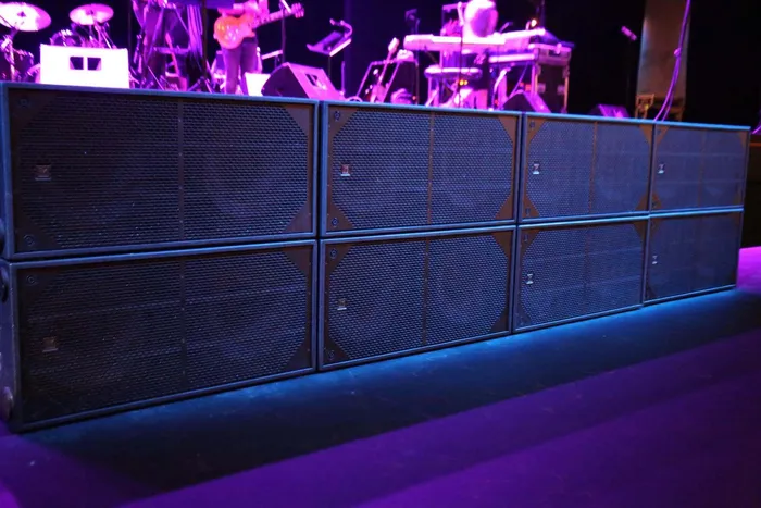 Professional EV subwoofer system providing powerful bass for a live music event.