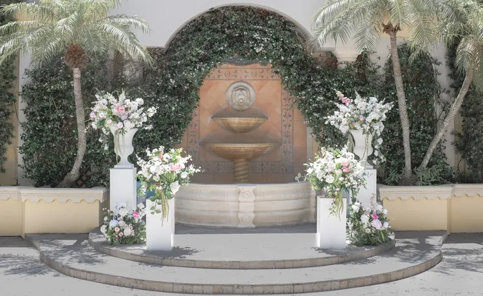 Faux wedding floral arch rental setup in Palm Beach County