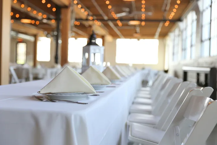 Event seating layout showing tables and chairs arranged for 100 guests